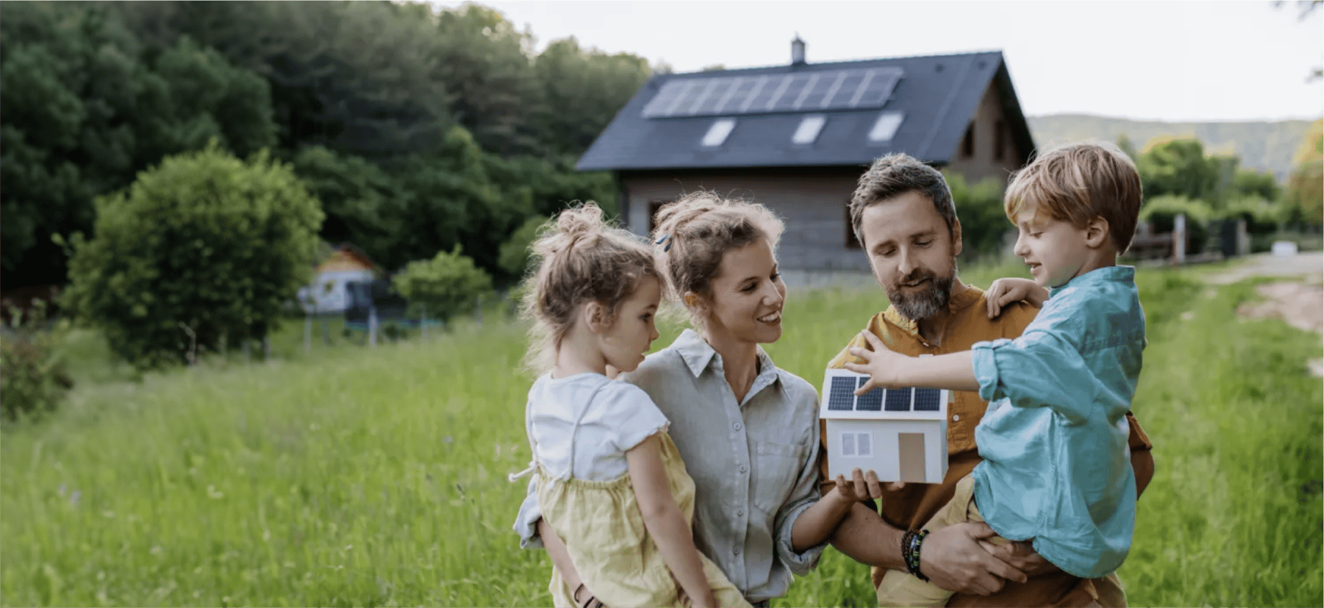 Family in front of solar powered home